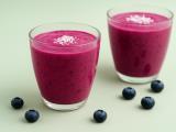A smoothie recipe called the elixir of youth: berries, kefir, and lemon in a glass of energy